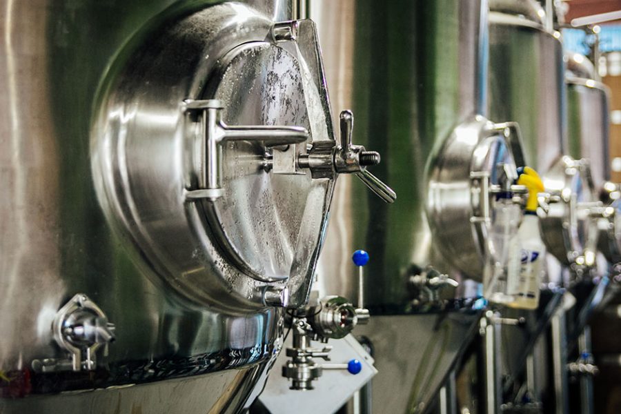 fermenters lined up in brewhouse x