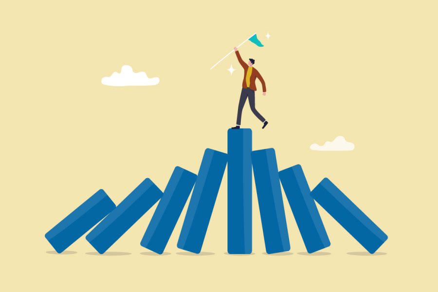 illustration of person standing with flag atop blocks