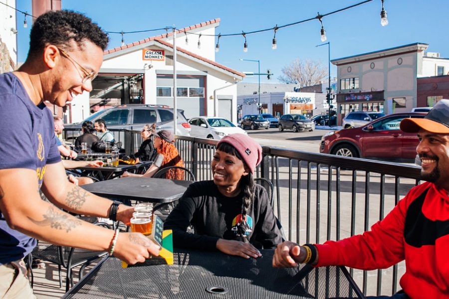 taproom server delivering taster glasses of beer to patrons 1200x628 1