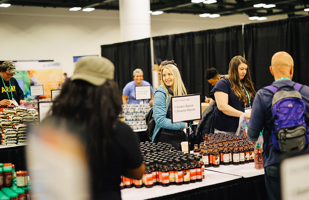 volunteers packing global flavor kits for food bank