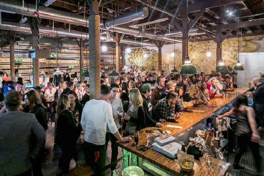people congregating at craft brewery